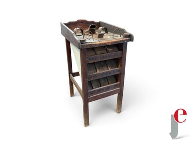 a small wooden table with a drawer on top of it