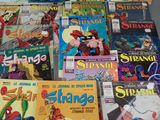 a lot of comic books on the table together