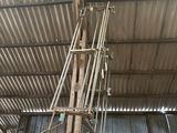 a large metal structure with pipes and wires in a building
