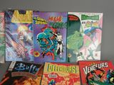 a lot of comic books that are on the table