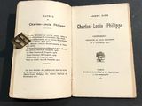 an open book with a stamp on top of it sitting on a table