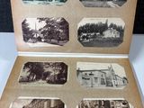 an old photo of a book with pictures of buildings on it