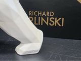 a figurine of a man ' s foot in front of a box