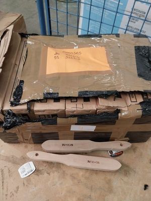 a cardboard box with a knife and fork in it
