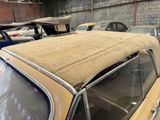 many old cars that are parked in a garage