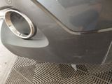 a close up of a car ' s exhaust pipe on the side of the car