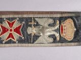 an image of a belt with a red cross, eagle, and a crown on it
