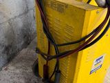 a yellow machine that is sitting on the ground