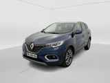 un SUV Renault bleu garé dans une pièce blanche
