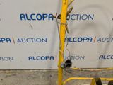 a yellow ladder with a sign on it that says alcopa