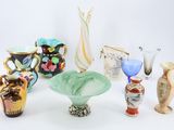 many different vases that are sitting on a table