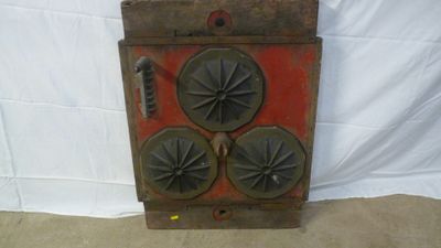 an old wooden stove with four burners on top of it