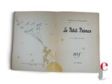 an open book with a picture of a little boy flying a kite