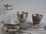 a lot of silver items that are on a table