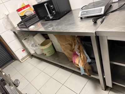 a laptop and a microwave on the counter in the kitchen