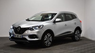 a silver renault suv parked in a room with a checkered floor