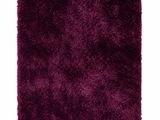 a close up of a purple rug on a white background