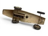 a small wooden toy airplane with wheels on a white surface