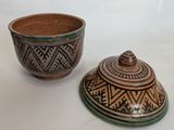 two bowls that are sitting next to each other on a table