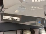 two microphones sitting on top of a box on a table