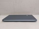 an open laptop computer sitting on top of a white table