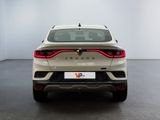 the rear end of a white car in a white room