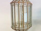 an antique brass and glass lantern hanging from the ceiling