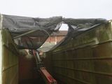 a truck that has a tarp on top of it