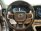 the interior of a car with a steering wheel and dashboard controls