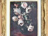 painting of flowers in a gold frame on a wood floor