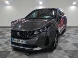 the front view of a grey car in a showroom