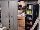 a room that has a refrigerator and some boxes in it