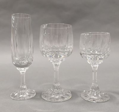 three empty wine glasses sitting next to each other on a table