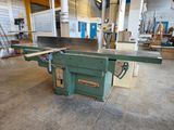 an image of a table saw in a workshop with other tools