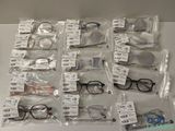 many pairs of glasses that are on the table