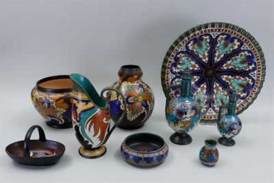 many different types of vases and bowls on the table