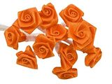a bunch of orange roses that are on a white table