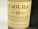 a bottle of alcohol that is sitting next to a box