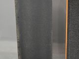 two speakers are shown side by side on a white surface