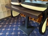 a piano that is sitting on a table in a room