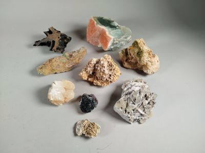 many different types of rocks and stones on the table