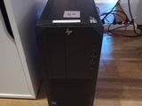 a black desktop computer sitting on a hard wood floor