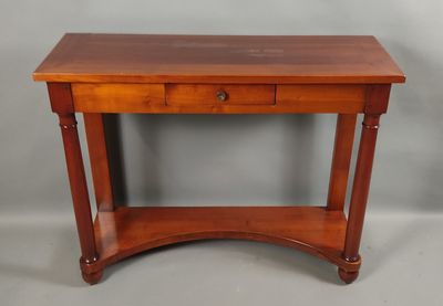 JEAN LAICK. Console en placage d'acajou, ouvrant à un tiroir…