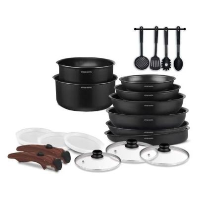 a group of black pots and pans sitting on top of each other