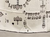 a black and white photo of a piece of paper with drawings on it