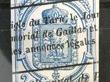 un vieux timbre sur lequel figure un blason