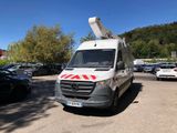 a white van with a red stripe parked in a parking lot