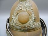 a gold helmet with a crown on top of it