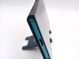 a close up of a cell phone that is on a stand