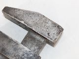 two pieces of metal that are laying on a table